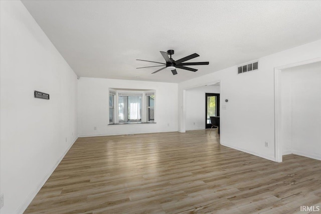 214 Mccutcheon Dr, Lafayette, IN 47909 - spare room featuring ceiling fan, light wood-type flooring, and baseboards