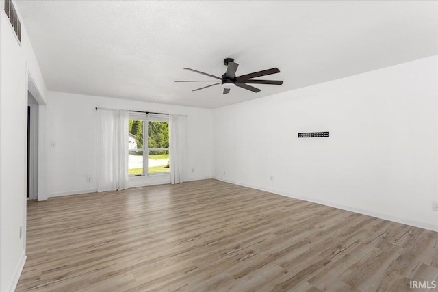 214 Mccutcheon Dr, Lafayette, IN 47909 - spare room featuring ceiling fan, light wood-style flooring, and baseboards