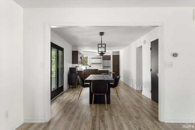 214 Mccutcheon Dr, Lafayette, IN 47909 - dining space with light wood-type flooring and baseboards