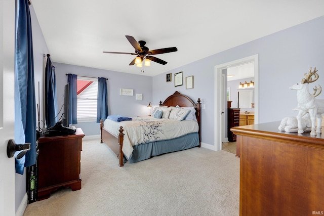 3367 E 550 S-57, Churubusco, IN 46723 - bedroom featuring light colored carpet, ceiling fan, baseboards, and ensuite bathroom