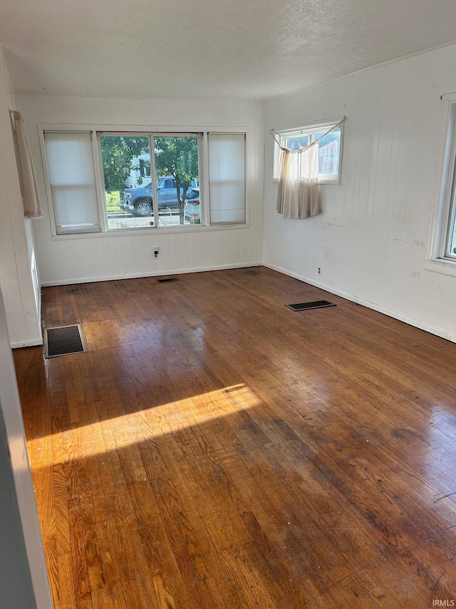 unfurnished room featuring hardwood / wood-style floors