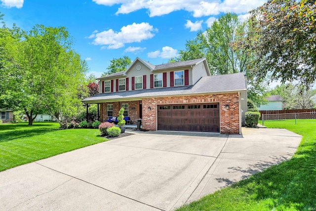 4113 S Hedgewood Ct, Bloomington, IN 47403 - view of front of house with brick siding, concrete driveway, and a porch