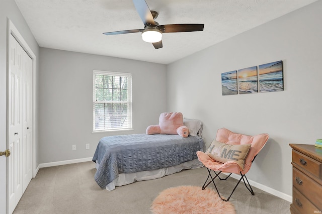 4113 S Hedgewood Ct, Bloomington, IN 47403 - carpeted bedroom featuring a closet, baseboards, and a ceiling fan