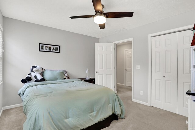 4113 S Hedgewood Ct, Bloomington, IN 47403 - bedroom with light colored carpet, baseboards, and a closet