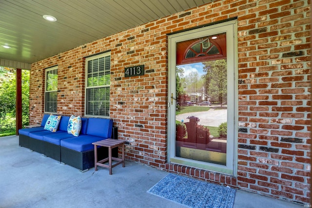 4113 S Hedgewood Ct, Bloomington, IN 47403 - doorway to property with a porch and brick siding