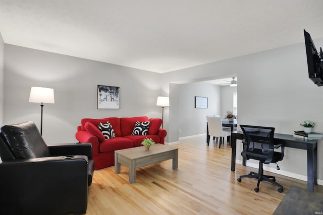4113 S Hedgewood Ct, Bloomington, IN 47403 - living room with light wood finished floors, ceiling fan, and baseboards