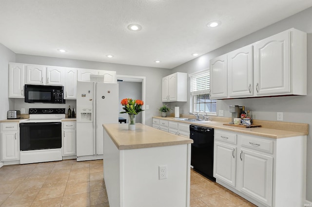 4113 S Hedgewood Ct, Bloomington, IN 47403 - kitchen featuring black appliances, a sink, a kitchen island, white cabinets, and recessed lighting