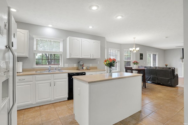 4113 S Hedgewood Ct, Bloomington, IN 47403 - kitchen featuring a sink, black dishwasher, a chandelier, a kitchen island, and white cabinets