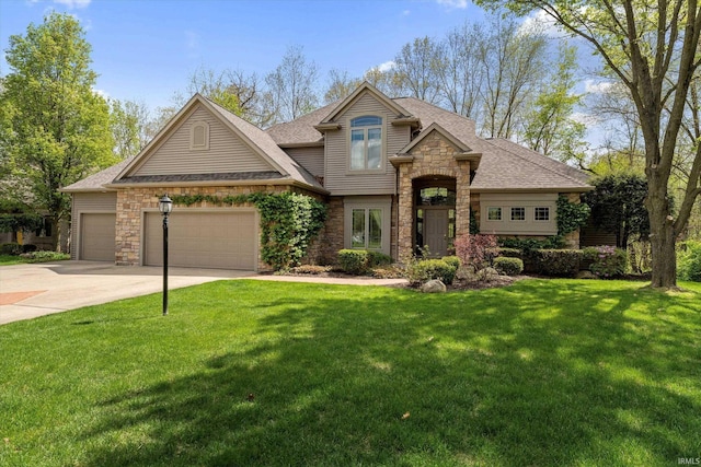 23306 Bluff Crest Dr, Elkhart, IN 46516 - view of front facade with stone siding, an attached garage, concrete driveway, and a front yard