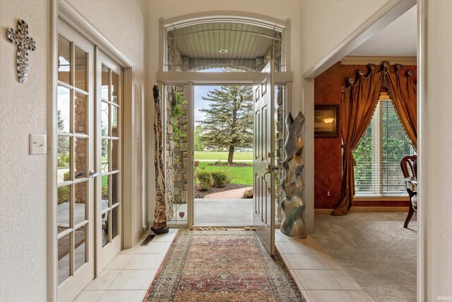 23306 Bluff Crest Dr, Elkhart, IN 46516 - foyer with french doors, plenty of natural light, and tile patterned floors