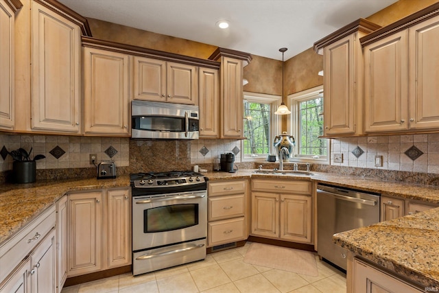 23306 Bluff Crest Dr, Elkhart, IN 46516 - kitchen featuring stainless steel appliances, a sink, decorative backsplash, light tile patterned flooring, and recessed lighting