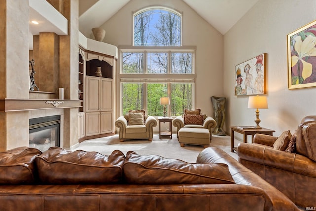 23306 Bluff Crest Dr, Elkhart, IN 46516 - living room with high vaulted ceiling, a tile fireplace, light carpet, and built in features