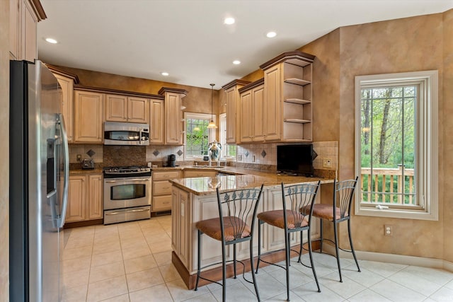 23306 Bluff Crest Dr, Elkhart, IN 46516 - kitchen featuring stainless steel appliances, a peninsula, healthy amount of natural light, open shelves, and recessed lighting