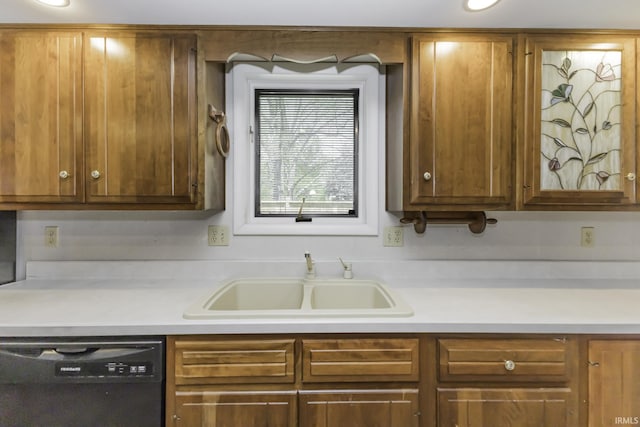3400 W Riggin Rd Unit 6, Muncie, IN 47304 - kitchen featuring dishwasher, a sink, light countertops, and brown cabinets