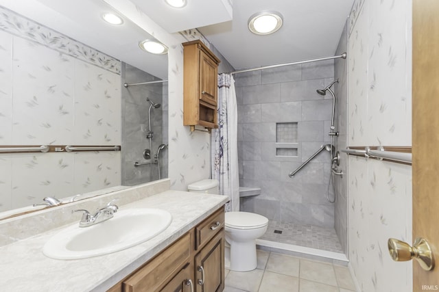 3400 W Riggin Rd Unit 6, Muncie, IN 47304 - bathroom featuring a tile shower, tile patterned floors, vanity, toilet, and recessed lighting