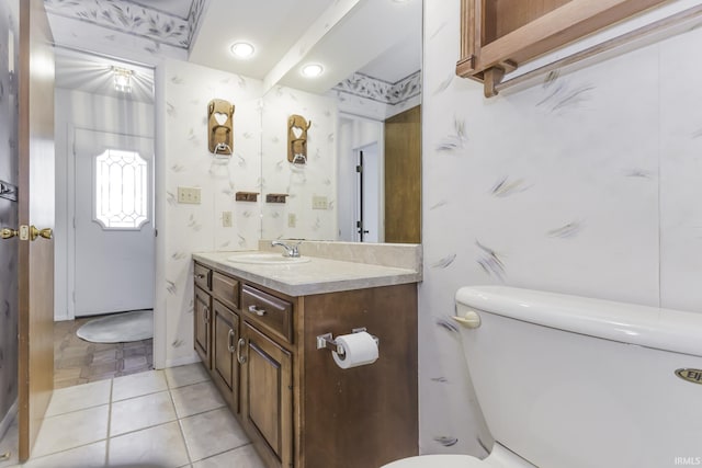 3400 W Riggin Rd Unit 6, Muncie, IN 47304 - bathroom featuring toilet, vanity, tile patterned flooring, and recessed lighting