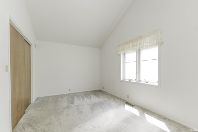 3400 W Riggin Rd Unit 6, Muncie, IN 47304 - unfurnished bedroom featuring lofted ceiling, carpet, and a closet