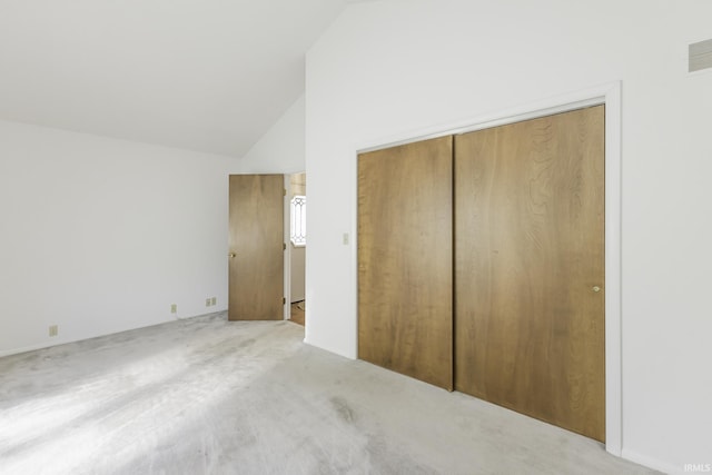 3400 W Riggin Rd Unit 6, Muncie, IN 47304 - unfurnished bedroom with a closet, high vaulted ceiling, and carpet