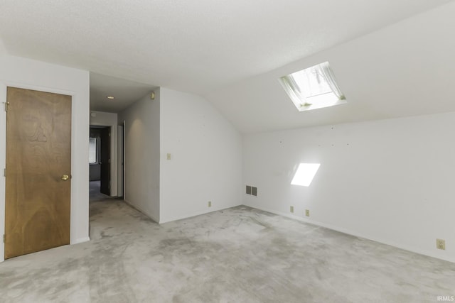 3400 W Riggin Rd Unit 6, Muncie, IN 47304 - additional living space featuring a skylight, light colored carpet, and vaulted ceiling