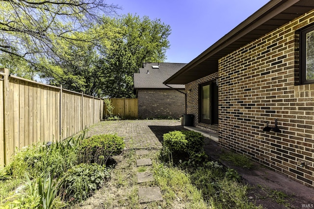 3400 W Riggin Rd Unit 6, Muncie, IN 47304 - fenced backyard with a patio area