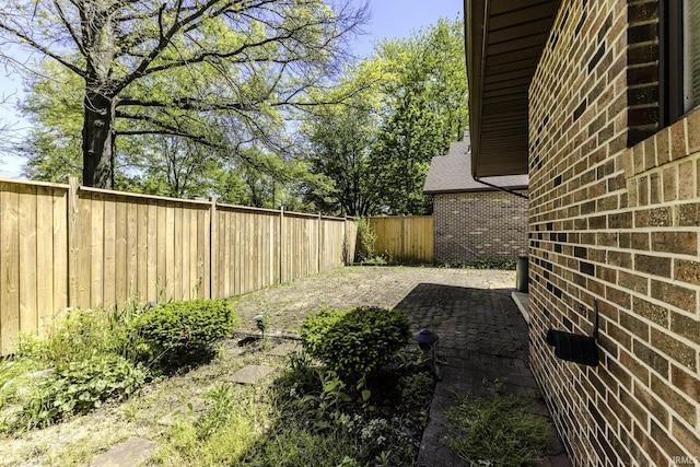 3400 W Riggin Rd Unit 6, Muncie, IN 47304 - fenced backyard featuring a patio
