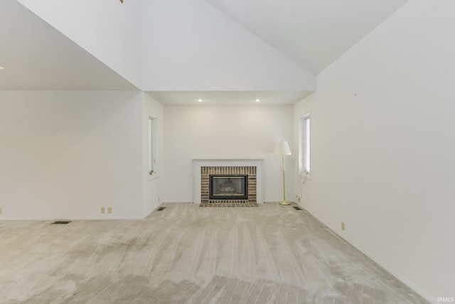 3400 W Riggin Rd Unit 6, Muncie, IN 47304 - unfurnished living room with high vaulted ceiling, light colored carpet, a fireplace, and recessed lighting