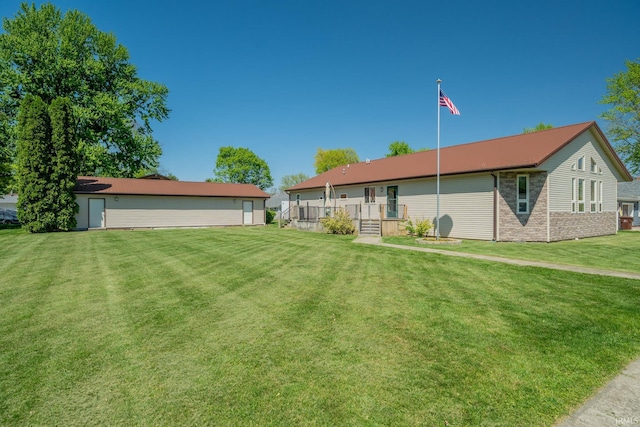 109 E Grant St, Lafontaine, IN 46940 - back of house featuring a lawn and an outdoor structure