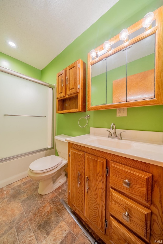109 E Grant St, Lafontaine, IN 46940 - bathroom featuring toilet, vanity, bath / shower combo with glass door, stone finish flooring, and recessed lighting
