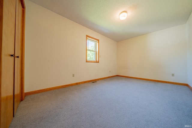 109 E Grant St, Lafontaine, IN 46940 - empty room with light colored carpet, baseboards, and vaulted ceiling