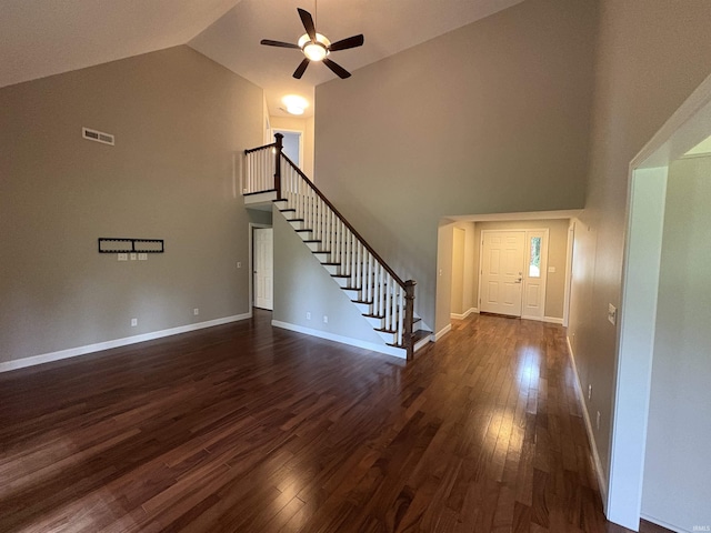 1643 W 1st St, Jasper, IN 47546 - unfurnished living room featuring stairway, high vaulted ceiling, a ceiling fan, dark wood-style flooring, and baseboards
