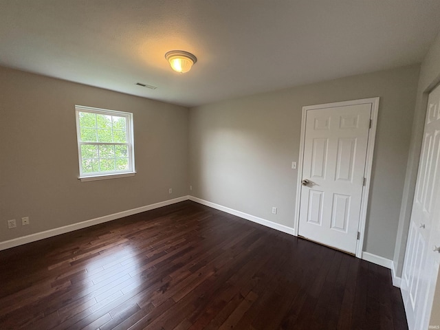 1643 W 1st St, Jasper, IN 47546 - unfurnished room featuring dark wood-style floors and baseboards
