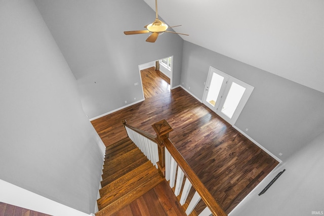 1643 W 1st St, Jasper, IN 47546 - stairway with wood finished floors, ceiling fan, high vaulted ceiling, french doors, and baseboards