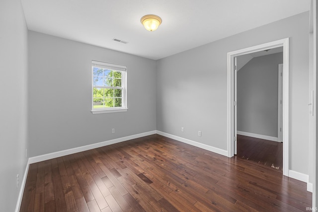 1643 W 1st St, Jasper, IN 47546 - empty room with dark wood finished floors and baseboards