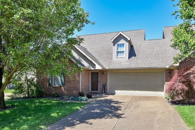 8122 Covington Ct, Newburgh, IN 47630 - view of front of home with brick siding, a garage, driveway, and a front yard