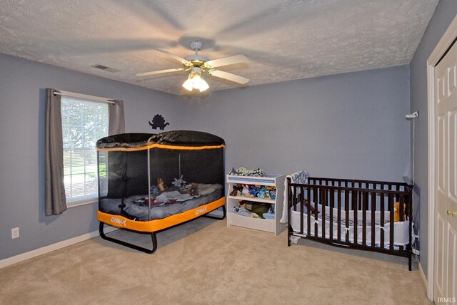 8122 Covington Ct, Newburgh, IN 47630 - bedroom with carpet flooring, a textured ceiling, baseboards, and ceiling fan