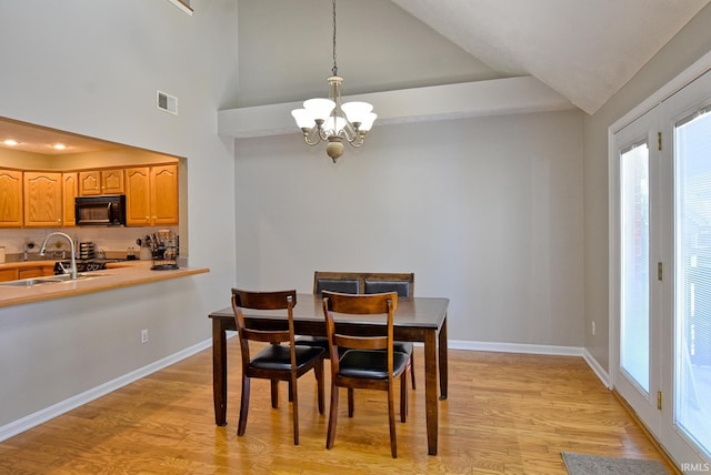 8122 Covington Ct, Newburgh, IN 47630 - dining space with a chandelier, light wood-style floors, plenty of natural light, vaulted ceiling, and recessed lighting