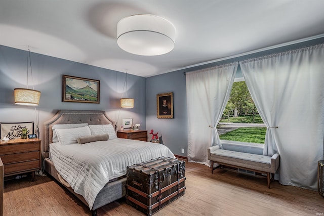 bedroom with wood finished floors