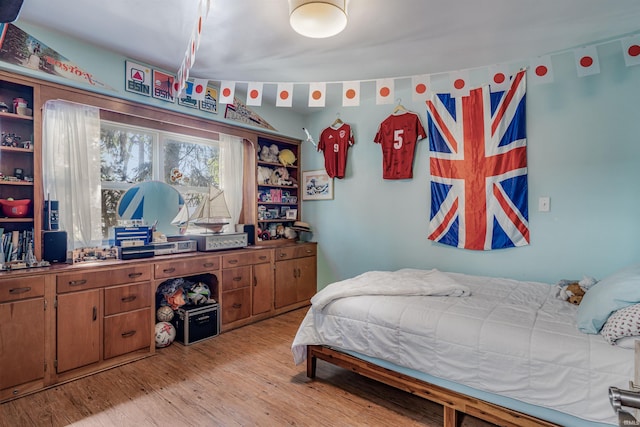 bedroom featuring light wood-style flooring