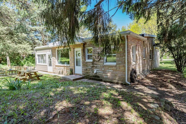view of front of house with stone siding