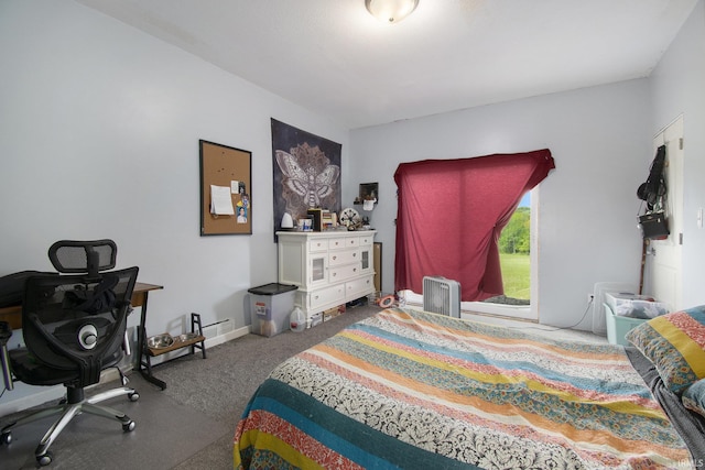 5025 N Elder Rd, Larwill, IN 46764 - carpeted bedroom with radiator