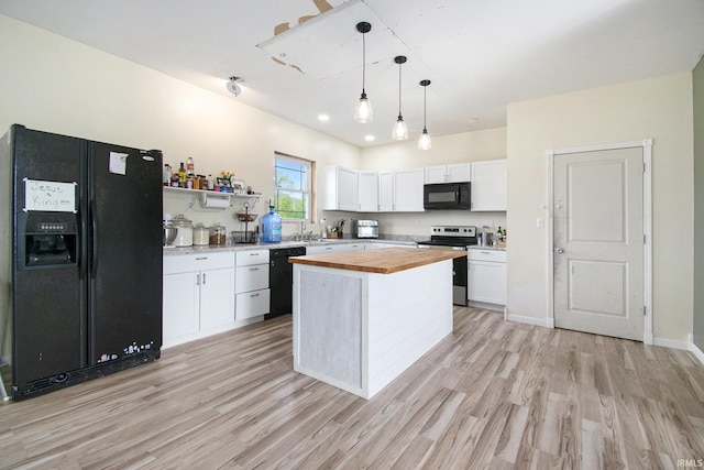 5025 N Elder Rd, Larwill, IN 46764 - kitchen with black appliances, wood counters, white cabinetry, and light wood finished floors