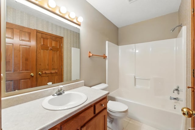 full bath featuring toilet, shower / tub combination, vanity, and tile patterned flooring