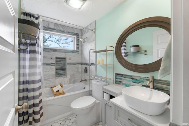 bathroom featuring shower / bathtub combination with curtain, toilet, and vanity