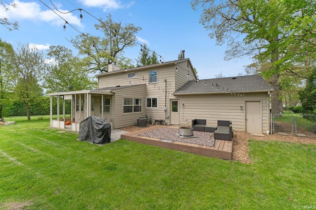 rear view of house with a sunroom, a chimney, a gate, a patio area, and cooling unit