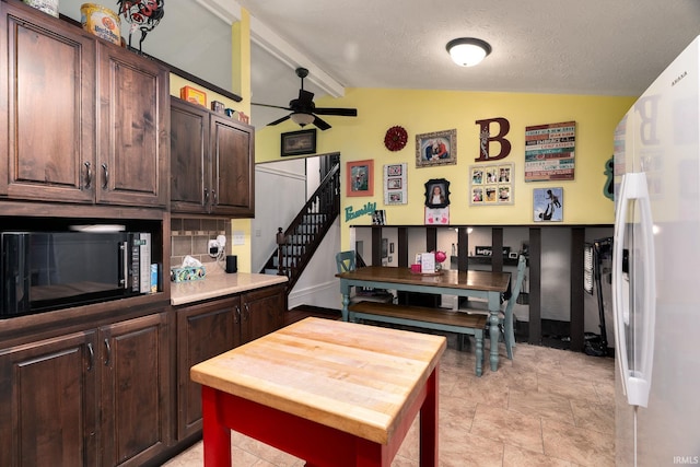 20 Gregory Ct, Lafayette, IN 47905 - kitchen featuring freestanding refrigerator, black microwave, a ceiling fan, wooden counters, and dark brown cabinetry