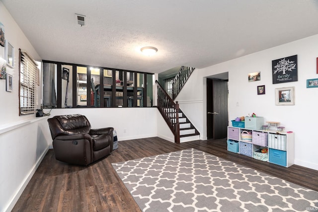 20 Gregory Ct, Lafayette, IN 47905 - living area with wood finished floors, baseboards, stairway, and a textured ceiling