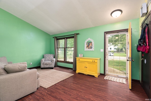 20 Gregory Ct, Lafayette, IN 47905 - living area with dark wood-type flooring, lofted ceiling, healthy amount of natural light, and baseboards
