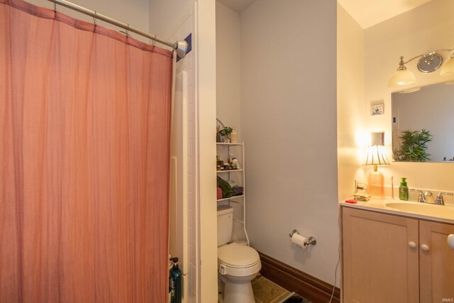 708 W 7th St, Bloomington, IN 47404 - bathroom with vanity, toilet, and a shower with shower curtain