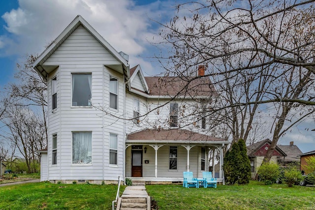 708 W 7th St, Bloomington, IN 47404 - view of front of property with covered porch, a front yard, and a chimney