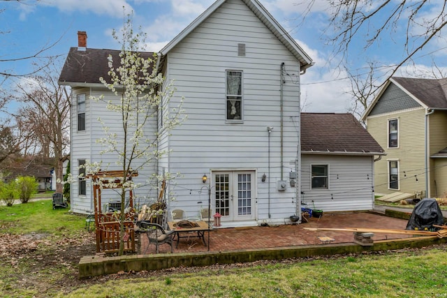 708 W 7th St, Bloomington, IN 47404 - rear view of house with a chimney, a lawn, a shingled roof, a patio area, and french doors
